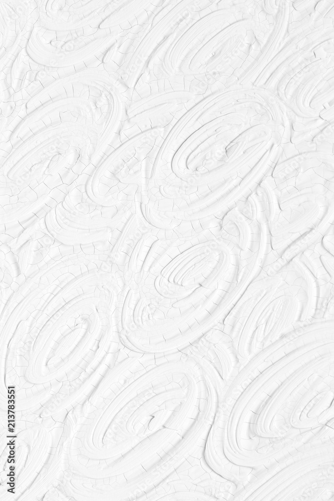 Fototapeta premium The texture of the paint is white. The background is drawn with a brush with a divorce on the wall.