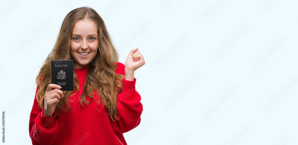 Naklejka premium Young blonde woman holding passport of United States of America screaming proud and celebrating victory and success very excited, cheering emotion