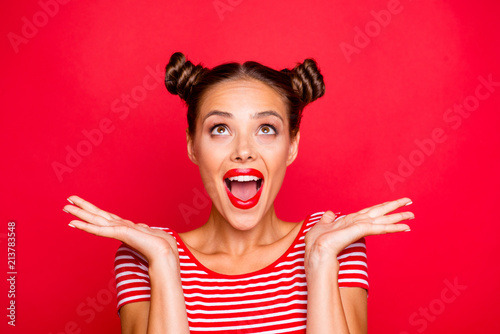So excited and positive girl isolated on red background loud laughs raising her head and hands up. Concept of advertising, sale and discount isolated on red background