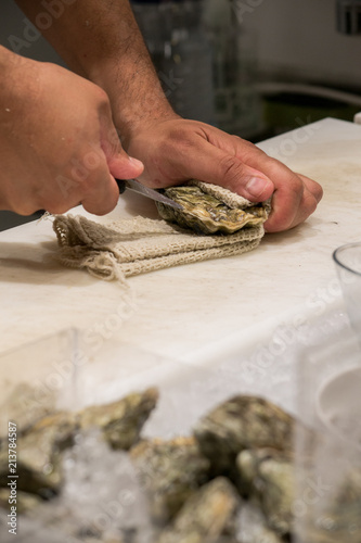 the chef prepares oysters