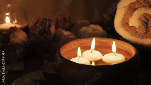 Cinemagraph - Burning candles in water. Composition of spa. Motion Photo.
