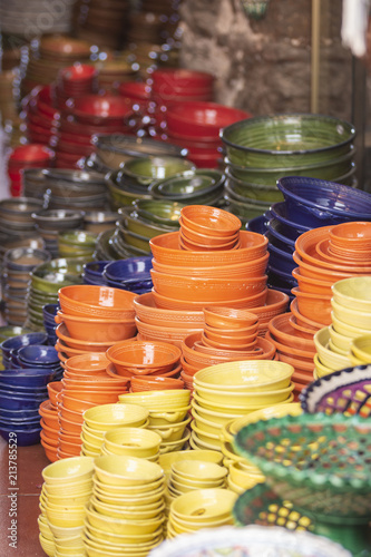 Pile of ceramic bowls of various sizes and colors
