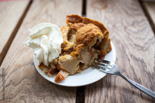 Dutch apple pie with whipped cream photo