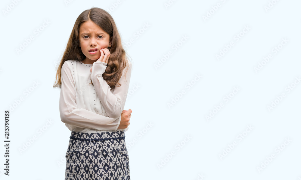 Brunette hispanic girl touching mouth with hand with painful expression because of toothache or dental illness on teeth. Dentist concept. Brunette hispanic girl touching mouth with hand with painful expression because of toothache or dental illness on teeth. Dentist concept.