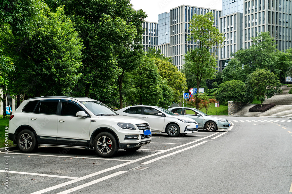 Outdoor parking lots and modern urban buildings Outdoor parking lots and modern urban buildings