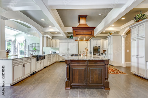 Stunning kitchen room design with large bar style island.