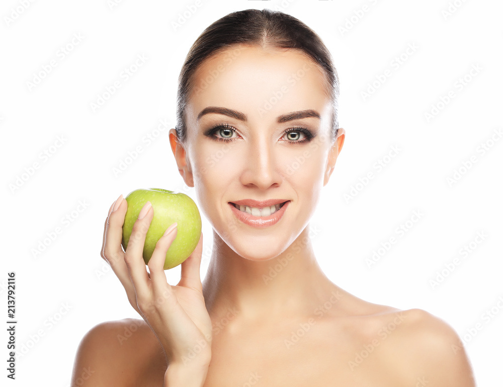 Beautiful smile, white strong teeth. Head and shoulders of young woman with snow-white smile holding green apple, teethcare. Beautiful smile, white strong teeth. Head and shoulders of young woman with snow-white smile holding green apple, teethcare.