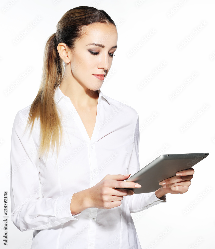 Woman holding tablet computer isolated on white background. working on touching screen. Casual smiling caucasian woman. Woman holding tablet computer isolated on white background. working on touching screen. Casual smiling caucasian woman.