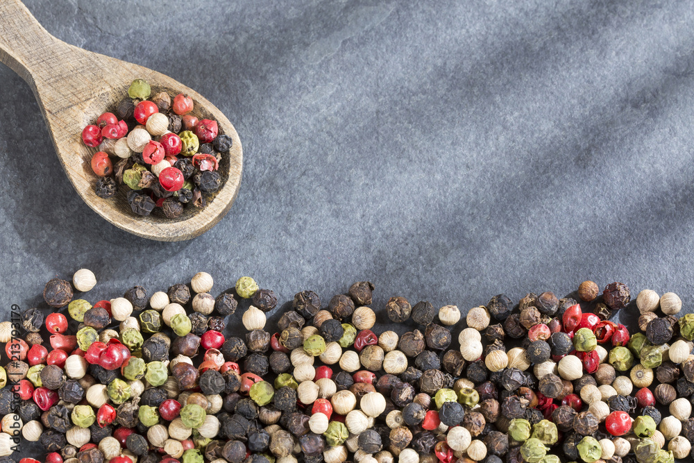 Mixture of colorful peppers. Wooden background - Top view