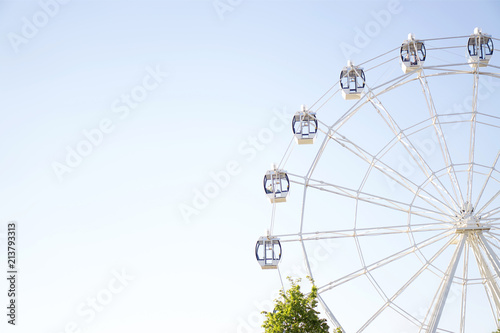 Ferris wheel on blue background