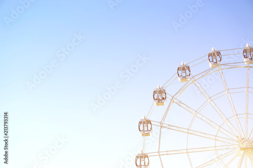 Ferris wheel on blue background