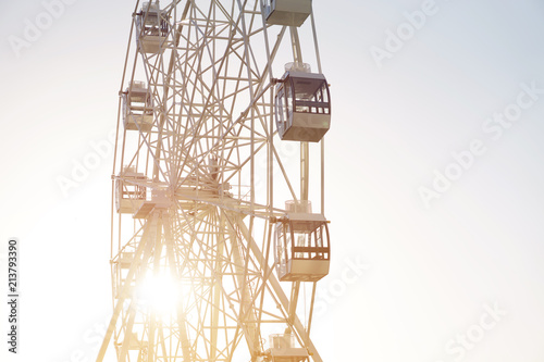 Ferris wheel on blue background