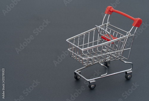 Shopping cart on gray background