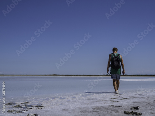Obraz na płótnie Young man walking away in the nature w salonie
