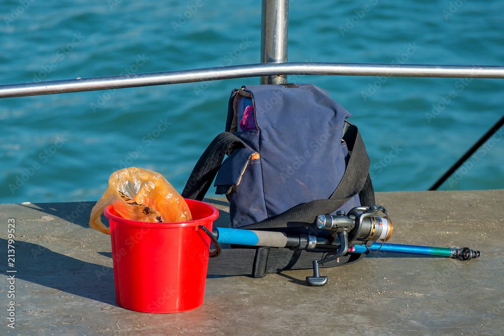 fishing rod backpack and fisherman things Stock Photo
