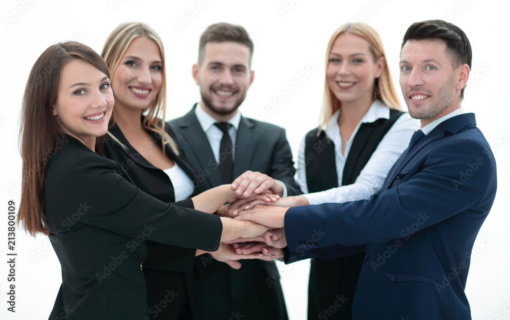 closeup.smiling business team with hands clasped together closeup.smiling business team with hands clasped together