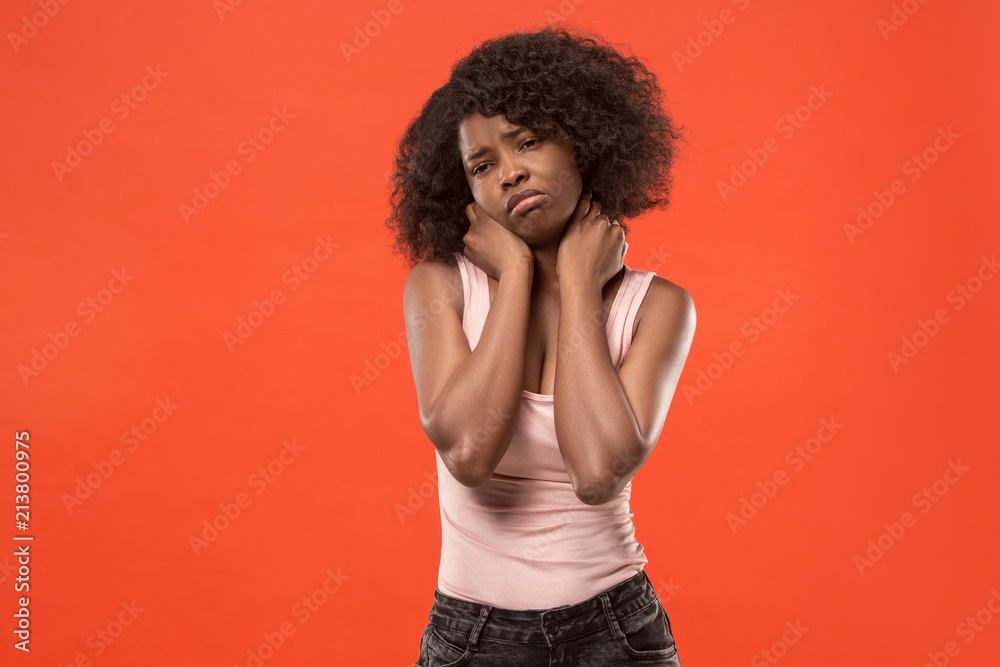 Beautiful woman looking suprised and bewildered isolated on red Beautiful woman looking suprised and bewildered isolated on red