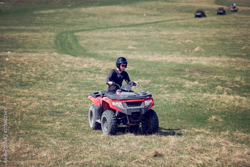 man riding atv vehicle on off road track ,people outdoor sport activitiies theme man riding atv vehicle on off road track ,people outdoor sport activitiies theme