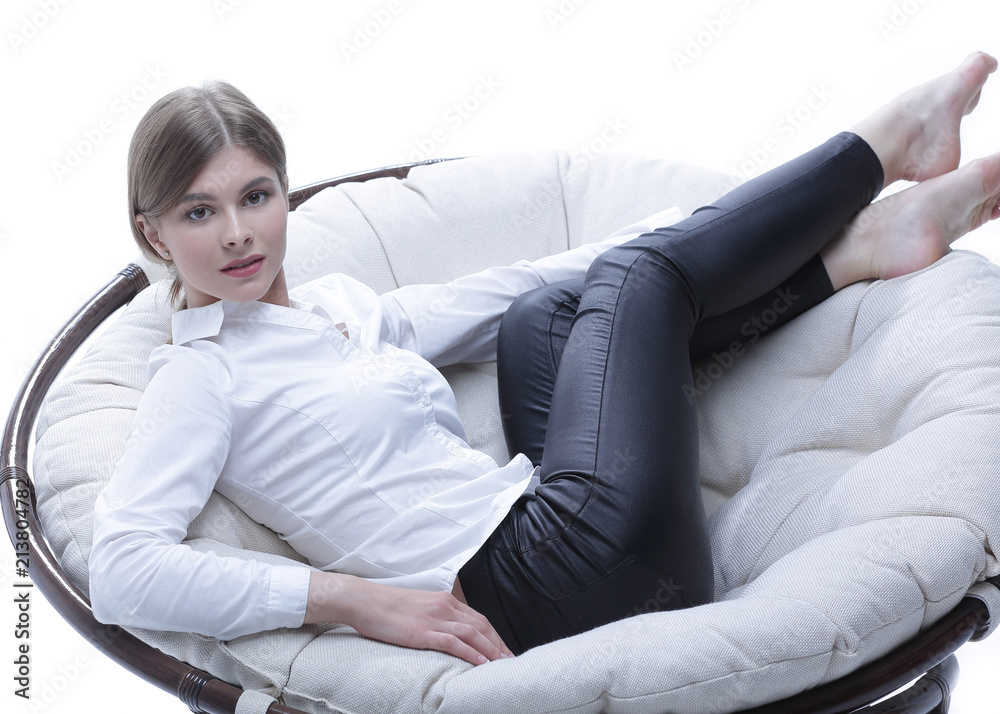 young business woman resting in a big soft chair young business woman resting in a big soft chair
