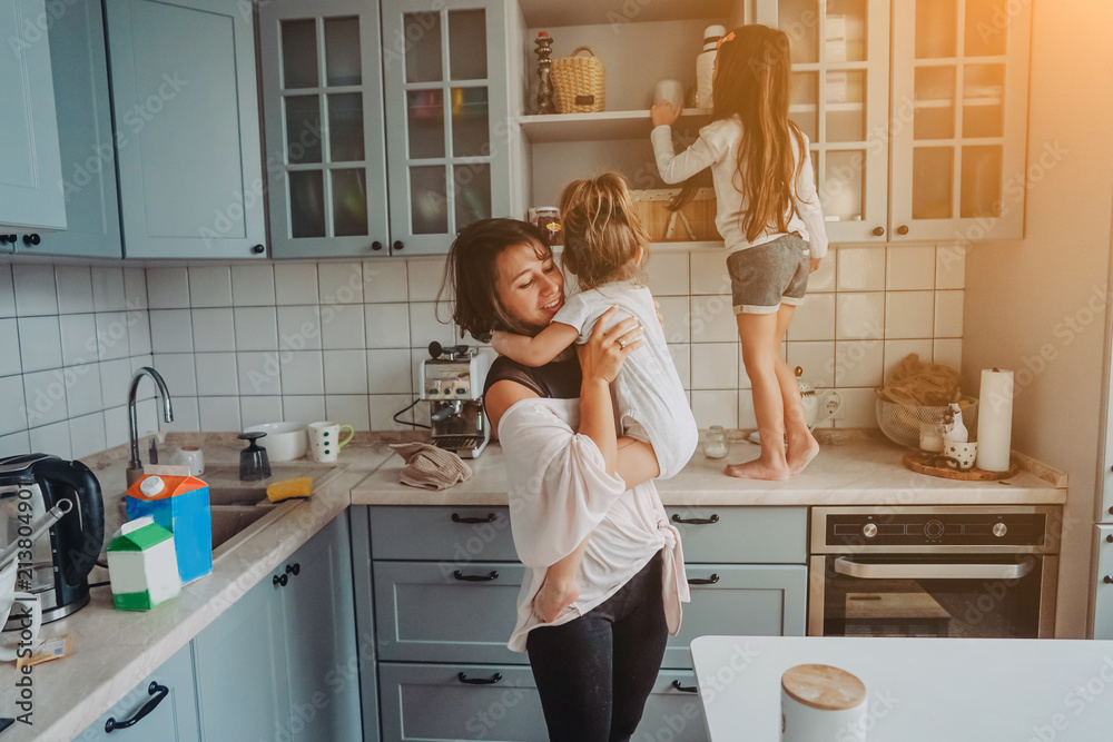 Happy family having fun in the kitchen Happy family having fun in the kitchen