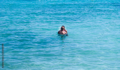 Two adults kissing at Balearic sea of Menorca