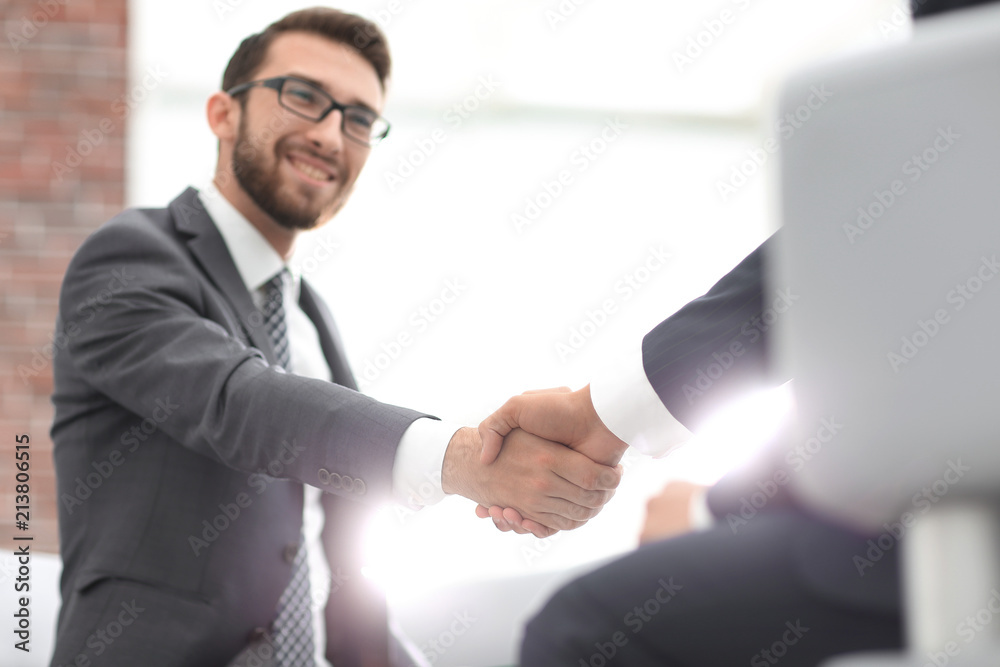 Fototapeta premium Close up of business handshake in the office