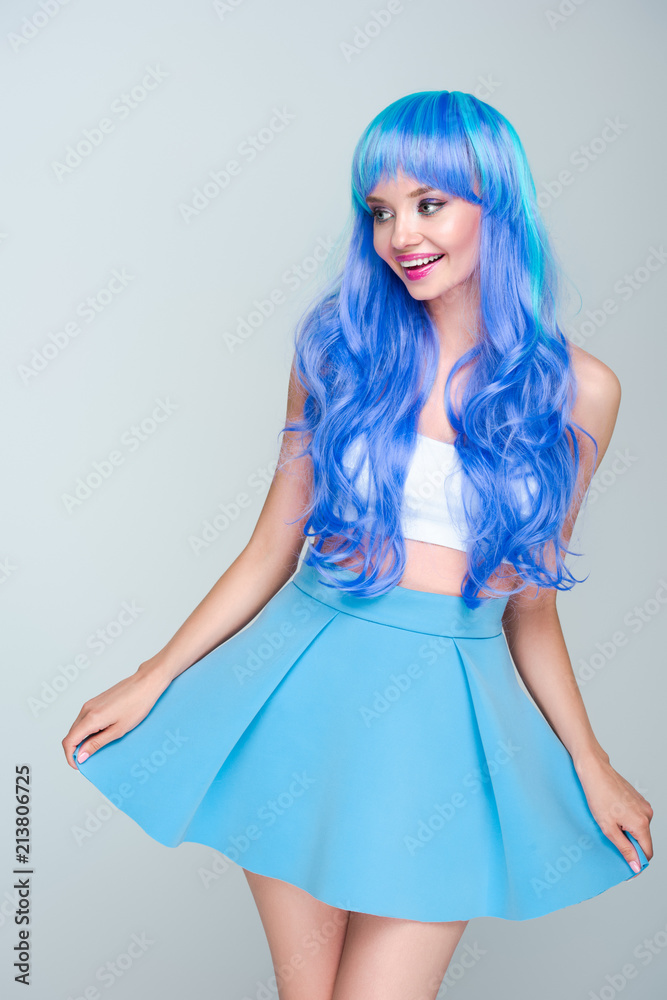 happy young woman with bright blue hair isolated on grey happy young woman with bright blue hair isolated on grey