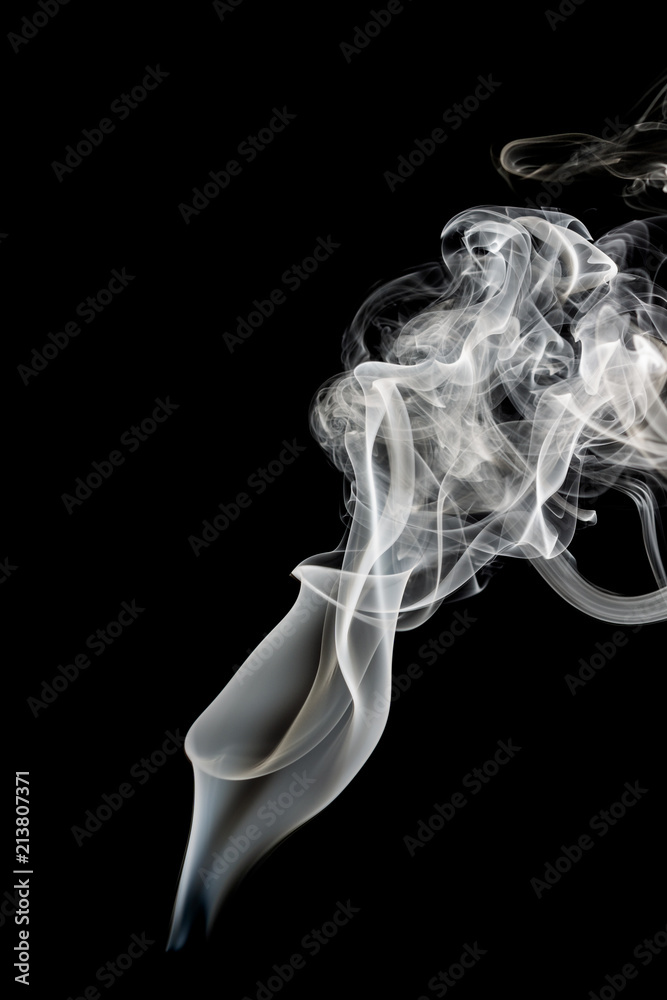 Abstract beautiful art. White smoke from the incense isolated on a black background. Abstract beautiful art. White smoke from the incense isolated on a black background.