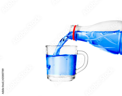 pouring water into a glass on a white background