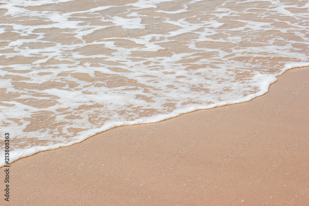 Soft wave of the blue ocean on the seashore of Thailand, copy space on the sand copy space Soft wave of the blue ocean on the seashore of Thailand, copy space on the sand copy space