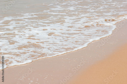 Soft wave of the blue ocean on the seashore of Thailand, copy space on the sand copy space