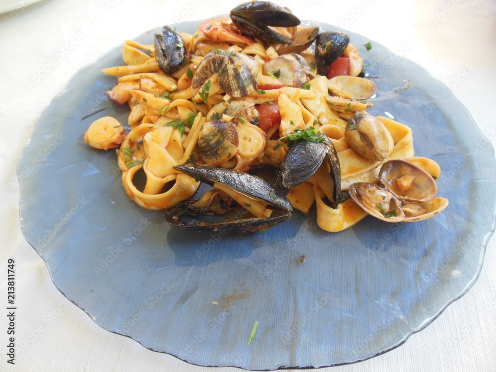 Beautiful Italian  plate of linguine marinara, pasta with seafood like clams, squid, vongole