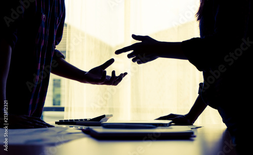 Silhouette Asian couple is fighting by the windows photo