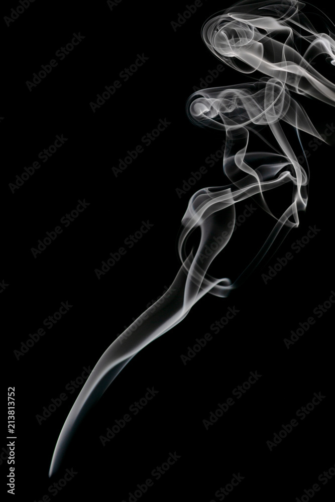 Abstract beautiful art. White smoke from the incense isolated on a black background. Abstract beautiful art. White smoke from the incense isolated on a black background.