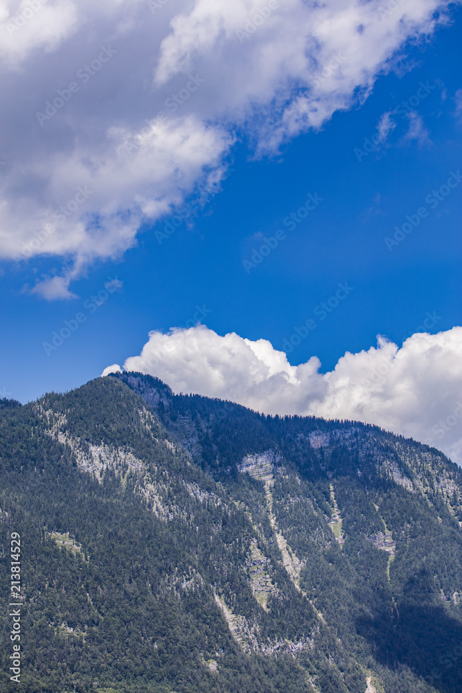 mountain tops and white clouds 
