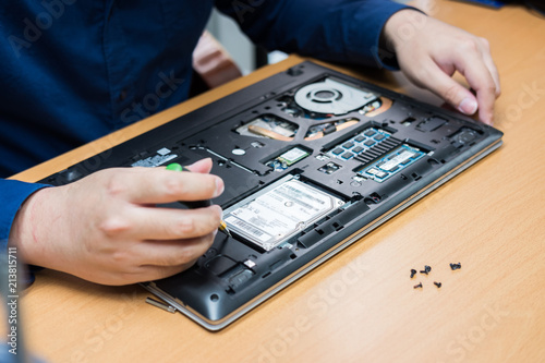 Technician support upgrade part and fixing laptop. select focus, Computer repair concept