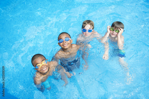 Children in outside swimming pool photo