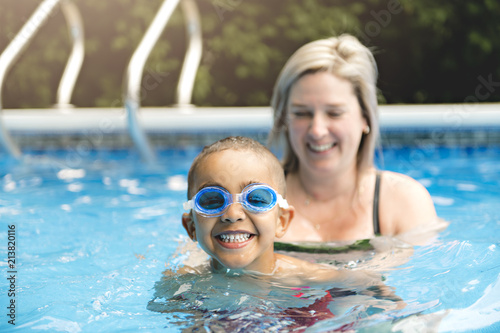 Mother and baby swim in the pool © Louis-Photo