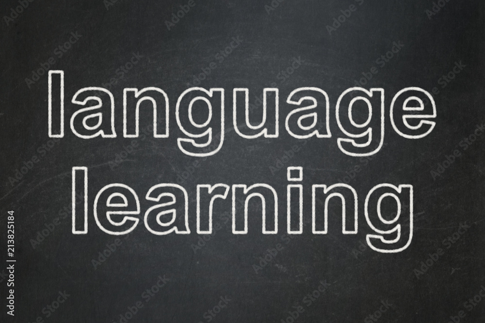 Learning concept: text Language Learning on Black chalkboard background Learning concept: text Language Learning on Black chalkboard background