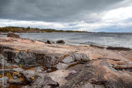 Beautiful seascape, the stone coast of the sea on the islands of Finland. The nature of Northern Europe © olezzo