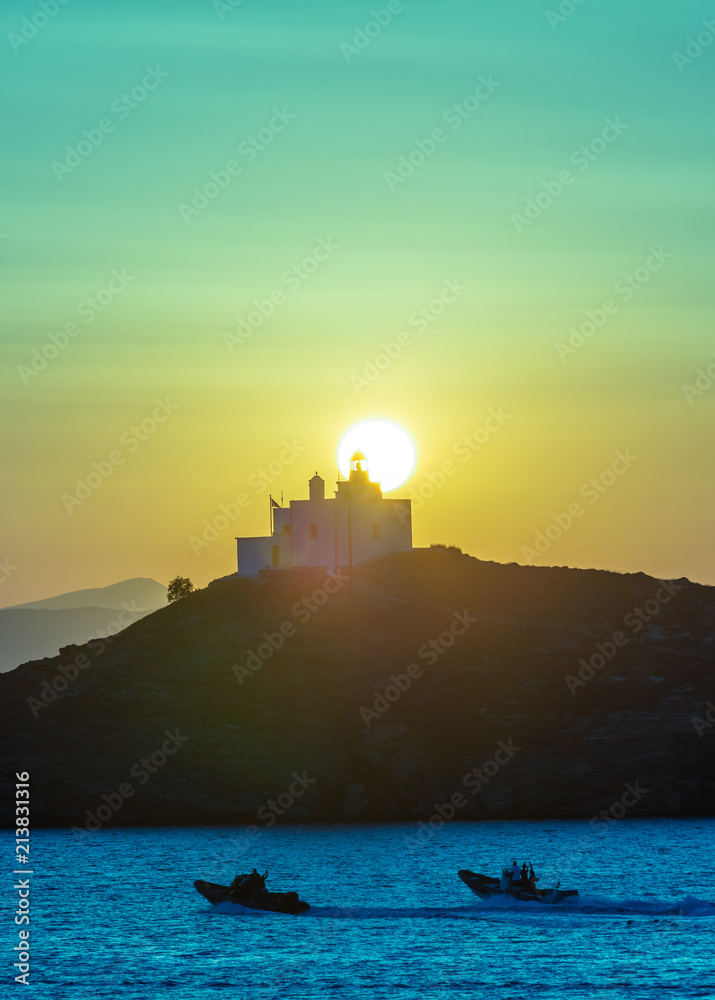 Mediterranean sea. Beautiful sunset and a lighthouse at Kea island, Greece. Mediterranean sea. Beautiful sunset and a lighthouse at Kea island, Greece.