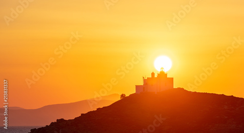 Mediterranean sea. Beautiful sunset and a lighthouse at Kea island  Greece.