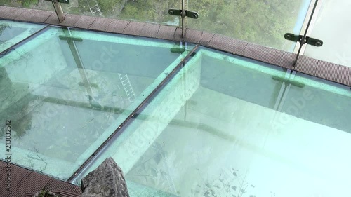 Tourists at the section with glass floor of the Tianmen mountain top path. China