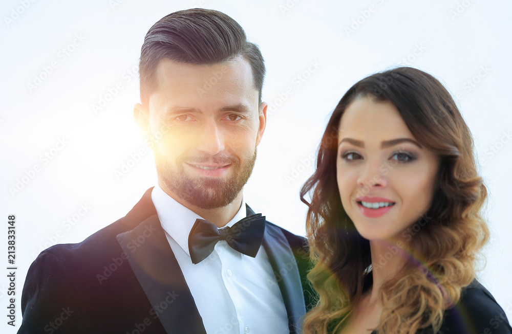 Portrait of a handsome man looking at the camera with a woman Portrait of a handsome man looking at the camera with a woman