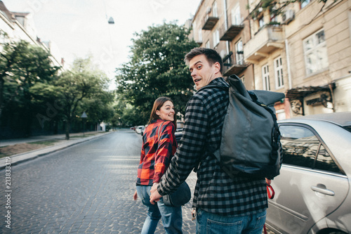 the couple runs and looks back