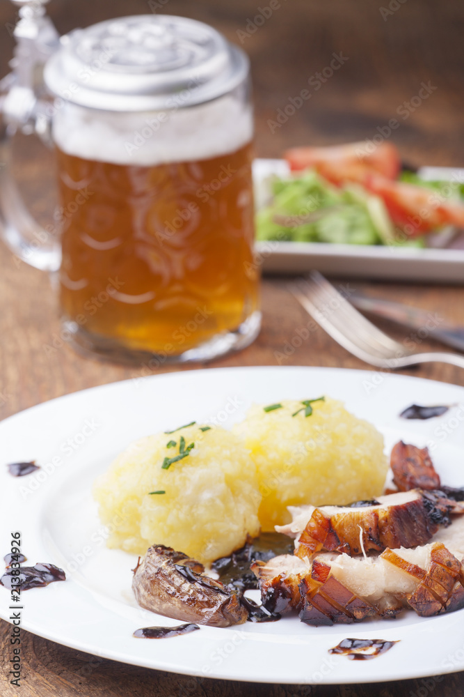 Bayerischer Schweinebraten mit Bier und Knödel Stock Photo | Adobe Stock