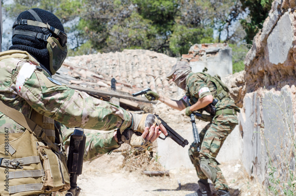 Fototapeta premium Airsoft group of soldiers abandoned house
