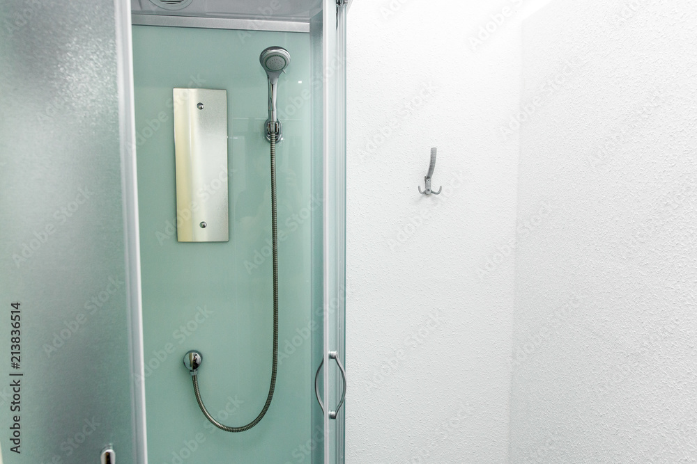 new shower cabin in physiotherapy rehab clinic. modern rehabilitation equipment. fitness wellness hygiene concept. space for text. public shower room new shower cabin in physiotherapy rehab clinic. modern rehabilitation equipment. fitness wellness hygiene concept. space for text. public shower room