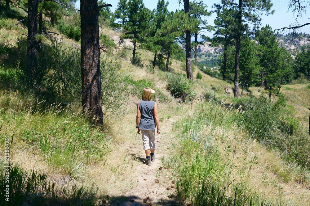 Woman hiking on a trail in the wildcat hills