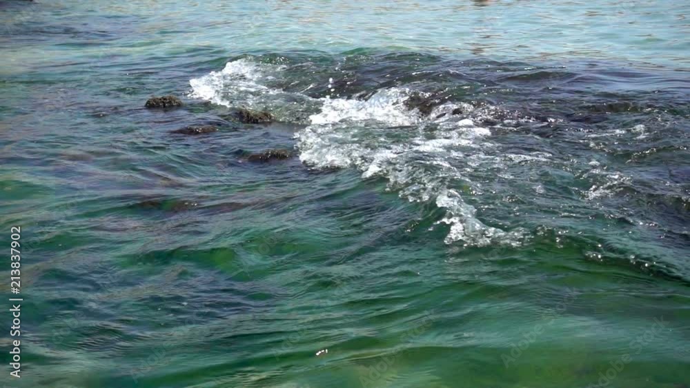 Slow motion of the waves rush into the stone reef at sea coast. Slow motion of the waves rush into the stone reef at sea coast.